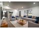 Bright living room featuring recessed lighting, modern decor, and a large window with natural light at 7631 Lewis Rd, Lakeland, FL 33810
