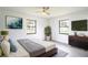 Bright bedroom with natural light, ceiling fan, and neutral color scheme at 7631 Lewis Rd, Lakeland, FL 33810