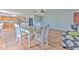 Open dining area next to the kitchen with wood floors, and ample seating for Gathering and friends at 169 Vista View Ave, Eagle Lake, FL 33839