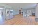 Open concept dining area featuring wood floors, natural light, and seamlessly connected to the kitchen at 169 Vista View Ave, Eagle Lake, FL 33839