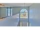Grand entryway with soaring ceilings, chandelier, large window, and stairway to the upper level at 169 Vista View Ave, Eagle Lake, FL 33839