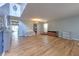 Sunlit living room with wood floors, ample space for furniture, and adjacent dining area with modern decor at 169 Vista View Ave, Eagle Lake, FL 33839