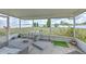 A screened-in patio offers a relaxing outdoor space with views of the fenced backyard at 169 Vista View Ave, Eagle Lake, FL 33839