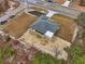 Aerial view of a home and backyard with a screened in porch and outdoor patio at 769 Marion Oaks Manor, Ocala, FL 34473