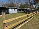 A view of a new wooden fence separating the yard from the neighbor at 1224 10Th St, Holly Hill, FL 32117