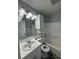 Bathroom featuring a white shower/bathtub, sink and black and white floor at 1224 10Th St, Holly Hill, FL 32117