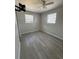 Bedroom with gray walls and new light-gray laminate flooring at 1224 10Th St, Holly Hill, FL 32117