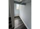 Inside walk-in closet with new light-gray laminate flooring at 1224 10Th St, Holly Hill, FL 32117