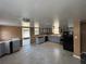Spacious kitchen with light gray cabinets, tile flooring, and black appliances at 1224 10Th St, Holly Hill, FL 32117