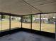 View from a screened porch to the fenced backyard at 1224 10Th St, Holly Hill, FL 32117