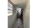 This utility room features a washer, dryer, water heater, and geometric tile floors at 1224 10Th St, Holly Hill, FL 32117
