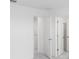 Bright bedroom with white walls and white doors showcases a minimalist and clean design at 4430 Petunia St, Lake Hamilton, FL 33851