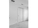Spacious closet with white walls and grey carpet showcasing a minimalist and clean design at 4430 Petunia St, Lake Hamilton, FL 33851