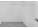 Empty walk-in closet with wire shelving, white walls, and grey carpet at 4430 Petunia St, Lake Hamilton, FL 33851