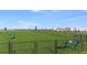Open community dog park with seating and waste station at 4430 Petunia St, Lake Hamilton, FL 33851