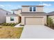 Charming two-story home featuring a spacious two-car garage and well-maintained landscaping at 4430 Petunia St, Lake Hamilton, FL 33851