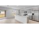 Modern kitchen featuring stainless steel appliances, an island with a sink, and ample cabinet space at 4430 Petunia St, Lake Hamilton, FL 33851