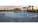 A community pool with shallow water features for children at 4430 Petunia St, Lake Hamilton, FL 33851