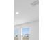 Bright room featuring natural light streaming through windows with a view of the neighborhood at 4430 Petunia St, Lake Hamilton, FL 33851