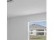 Bright room with a view of the surrounding neighborhood through a window at 4430 Petunia St, Lake Hamilton, FL 33851
