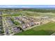 Aerial view of community showing new homes and open space at 4454 Petunia St, Lake Hamilton, FL 33851