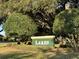 Community sign amid lush landscaping, welcoming residents and visitors to the Lakes neighborhood at 17729 Se 114Th Ct, Summerfield, FL 34491