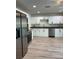 Updated kitchen featuring stainless steel appliances and granite countertops, perfect for cooking at 17729 Se 114Th Ct, Summerfield, FL 34491