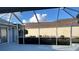 Relaxing screened patio offering ample space for outdoor entertaining with beautiful views at 17729 Se 114Th Ct, Summerfield, FL 34491