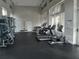 Community gym featuring multiple treadmills, weight machines, free weights, and large windows for natural light at 1263 Verdant Glade Pl, Winter Park, FL 32792