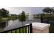 Community water fountain surrounded by lush landscaping and several single Gathering homes in the background at 1263 Verdant Glade Pl, Winter Park, FL 32792