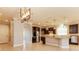 Open concept kitchen with island and dark wood cabinets at 368 Toldedo Rd, Davenport, FL 33837