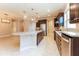 Open concept kitchen with island, granite countertops and stainless steel appliances at 368 Toldedo Rd, Davenport, FL 33837