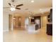 Open kitchen with island, granite counters, stainless steel appliances at 368 Toldedo Rd, Davenport, FL 33837