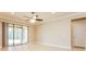 Bright living room with tile floors and sliding glass doors to patio at 368 Toldedo Rd, Davenport, FL 33837