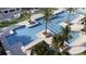 Community pool with multiple sections and surrounding landscaping at 4464 Sw 84Th Street Rd, Ocala, FL 34476