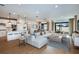 Open concept living space with large sectional sofa, hardwood floors, and island kitchen at 4464 Sw 84Th Street Rd, Ocala, FL 34476