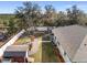 Aerial view of a backyard with a shed, patio, and white vinyl fencing at 3805 Sw 115Th St, Ocala, FL 34476