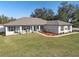 Charming single story home with a well-manicured lawn and inviting front porch at 3805 Sw 115Th St, Ocala, FL 34476