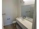 Modern bathroom featuring a vanity with sink and large mirror at 1210 Southstation Pl # 202, Orlando, FL 32809
