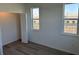 Bedroom with hardwood floors and large window at 1210 Southstation Pl # 202, Orlando, FL 32809