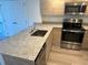 Modern kitchen with granite countertops at 1210 Southstation Pl # 202, Orlando, FL 32809