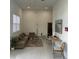 Spacious living room with modern furniture and large windows at 1210 Southstation Pl # 202, Orlando, FL 32809
