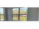 Bright room with large windows offering scenic views of nature and distant buildings at 1210 Southstation Pl # 202, Orlando, FL 32809