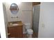 Cozy bathroom featuring a granite vanity, oval mirror, and glass-enclosed shower at 4340 S Kirkman Rd # 905, Orlando, FL 32811