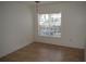 Neutral-toned vacant bedroom features a window with blinds and tile floors at 4340 S Kirkman Rd # 905, Orlando, FL 32811