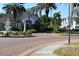 Exterior view of the community clubhouse with statues and mature trees at 4340 S Kirkman Rd # 905, Orlando, FL 32811