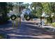 Gated entrance to the Sunset Lake community with black iron fence and decorative wreaths at 4340 S Kirkman Rd # 905, Orlando, FL 32811