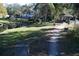 Scenic community view with lush greenery, pond, and charming gazebo at 4340 S Kirkman Rd # 905, Orlando, FL 32811