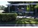 Sunset Lake Condominium entrance sign with lush landscaping and palm trees at 4340 S Kirkman Rd # 905, Orlando, FL 32811