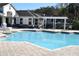Large community pool featuring a pergola-shaded seating area at 4340 S Kirkman Rd # 905, Orlando, FL 32811